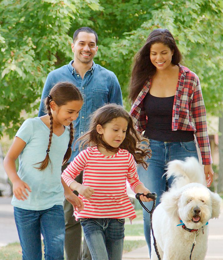 Financial Planning Services -- New England Financial Advisors. A young family playing in a Boston park