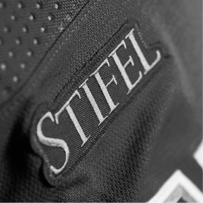 Black and white image of a St. Louis Blues jersey with the Stifel patch on the front