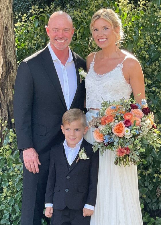 Kevin Willoughby's wedding day with his bride and kid