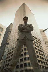 Man in front of skyscraper