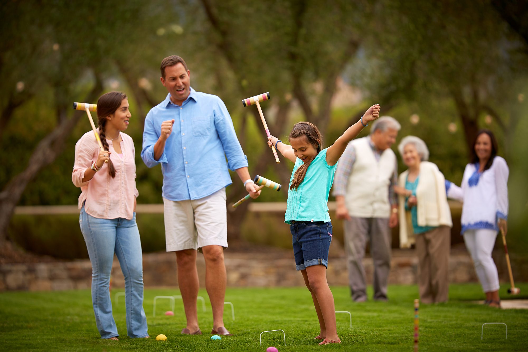 family playing in the yard