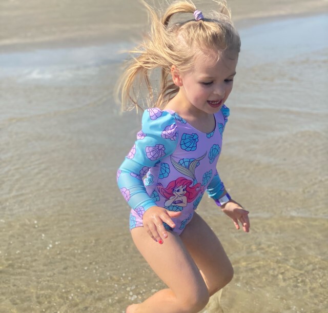 Granddaughter at beach splashing age 5