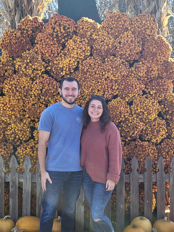 Tyler couple by fence