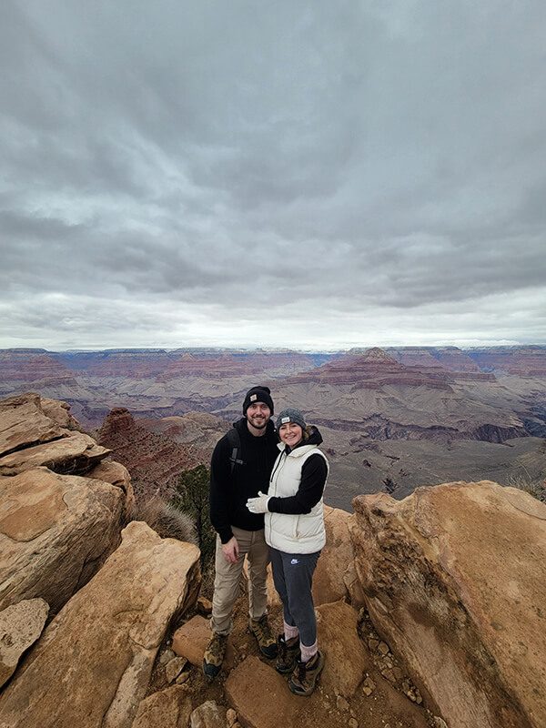 Tyler couple on mountain rocks edge